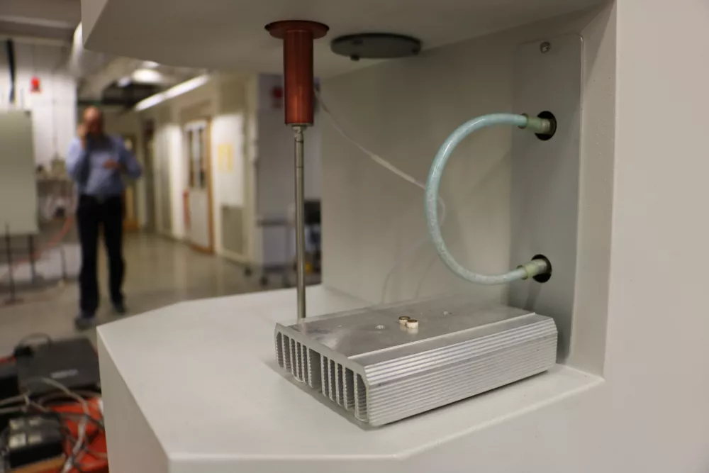 Detail of the Fire lab with a researcher in the background. Photo.